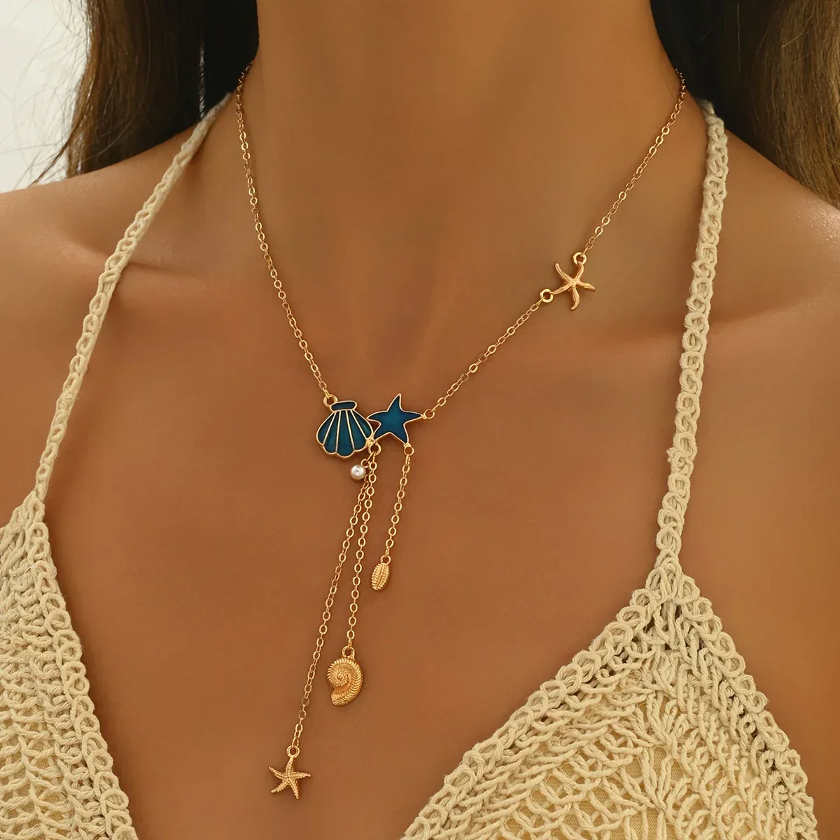 Elegant Gold Necklace with Blue Star and Shell